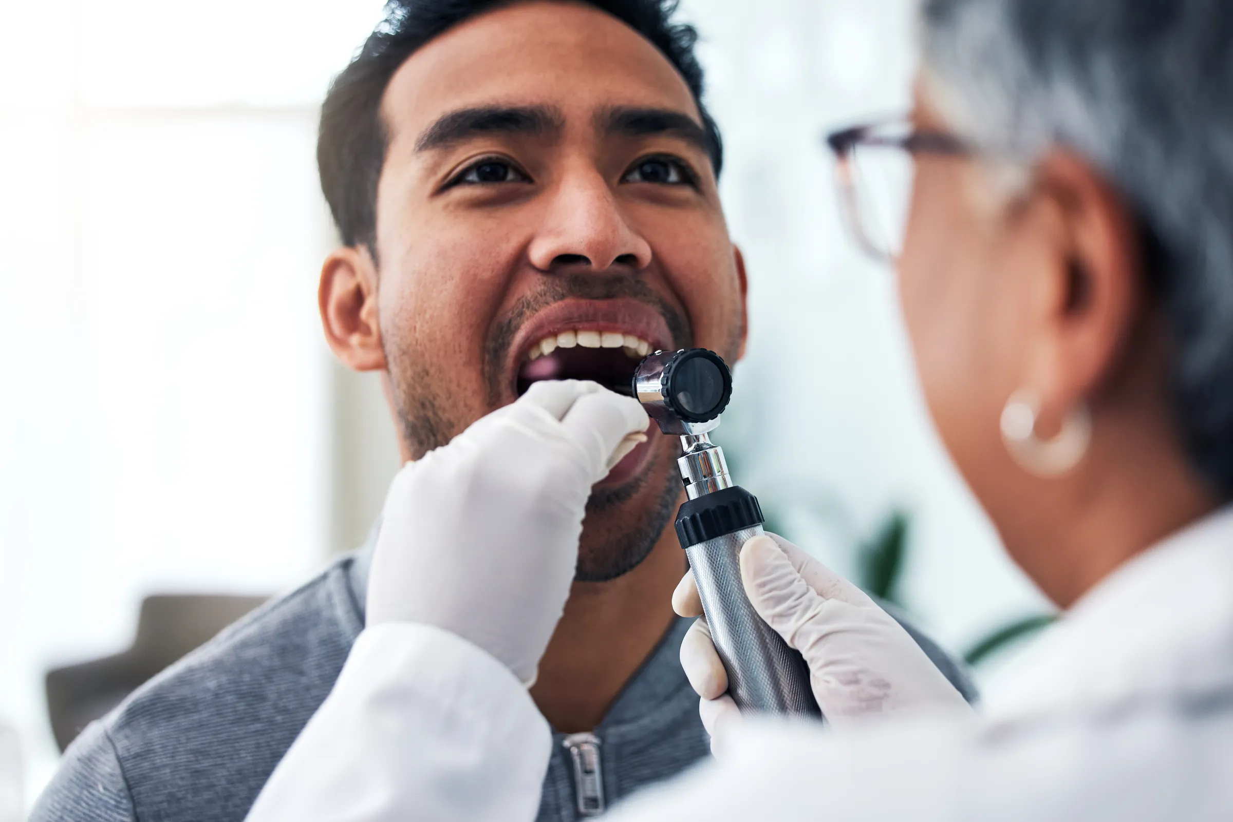 Oral cancer screening during a routine exam at Dental Studio of Marin
